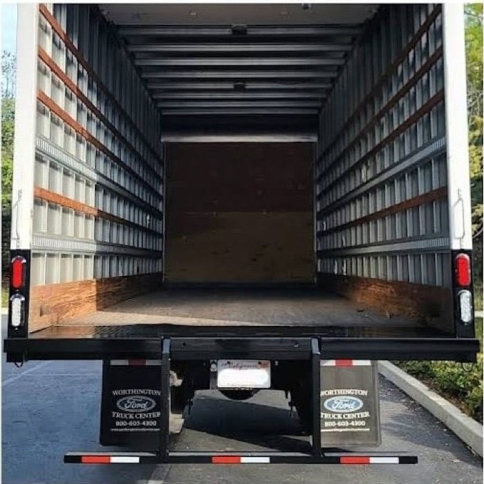 Rear of the box truck with the finished rear bumper and a clean box interior