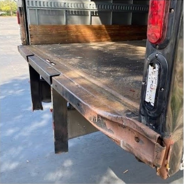 Box truck rear bumper rusted, bent and crushed