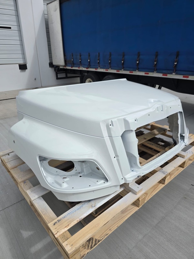 Truck hood repaired and refinished