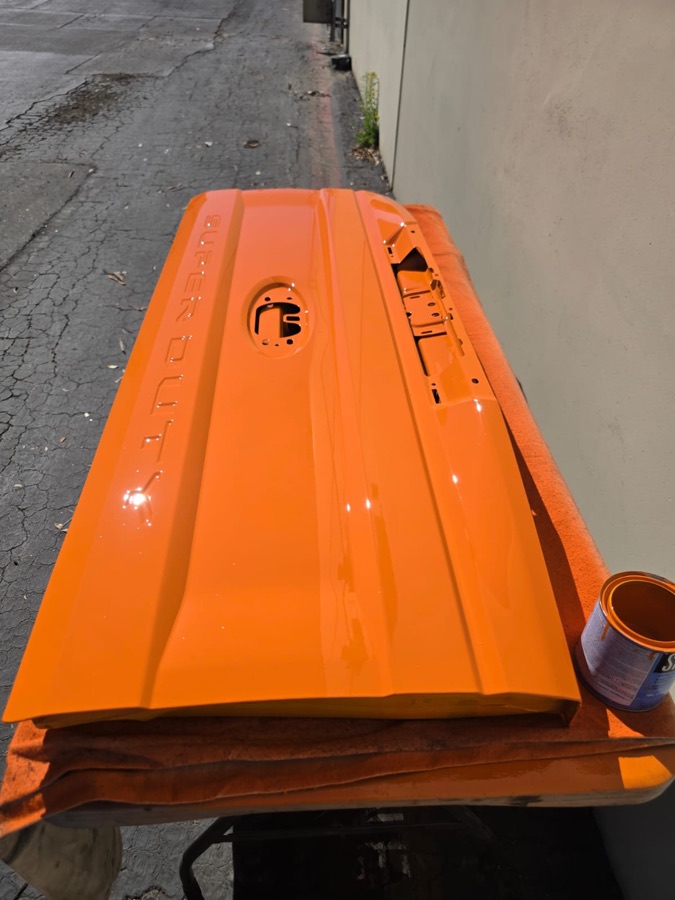 Freshly painted orange Super Duty tailgate