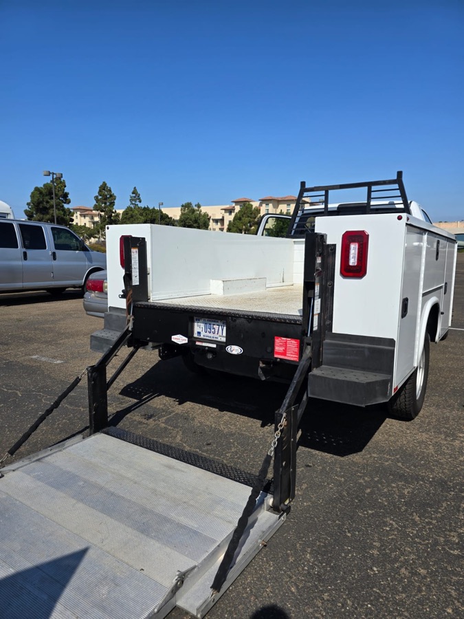 Utility truck with a liftgate and rack