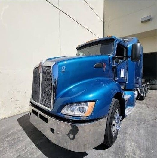 Finished blue Kenworth tractor with a clean, glossy hood