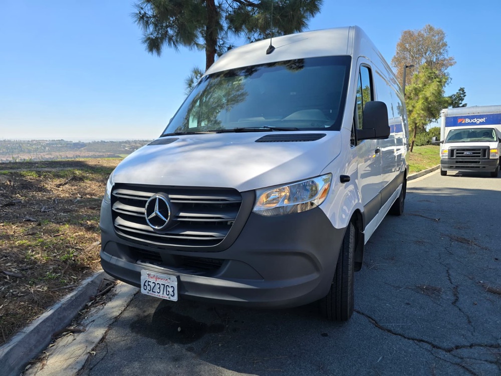 White Mercedes Sprinter van with the front end rebuilt and refinished