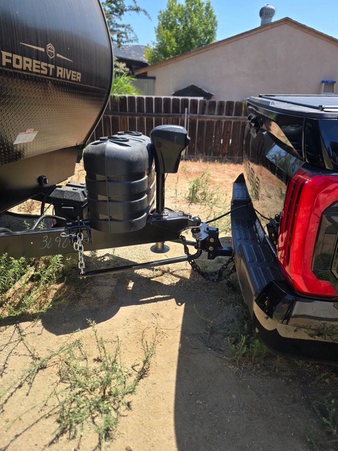 Travel trailer hitch and sway control