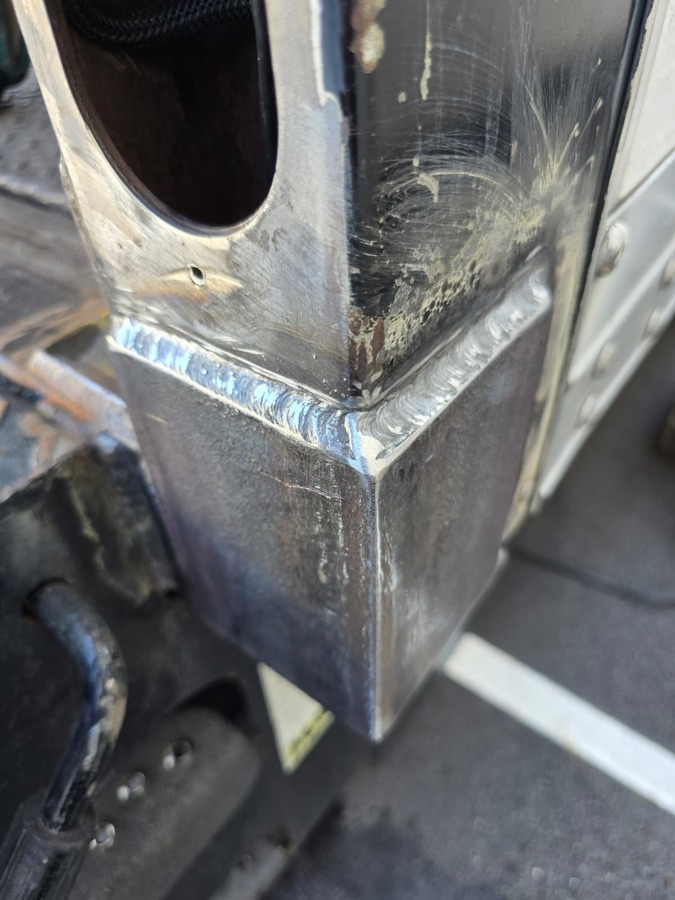 Close-up of a clean weld on a box truck corner post