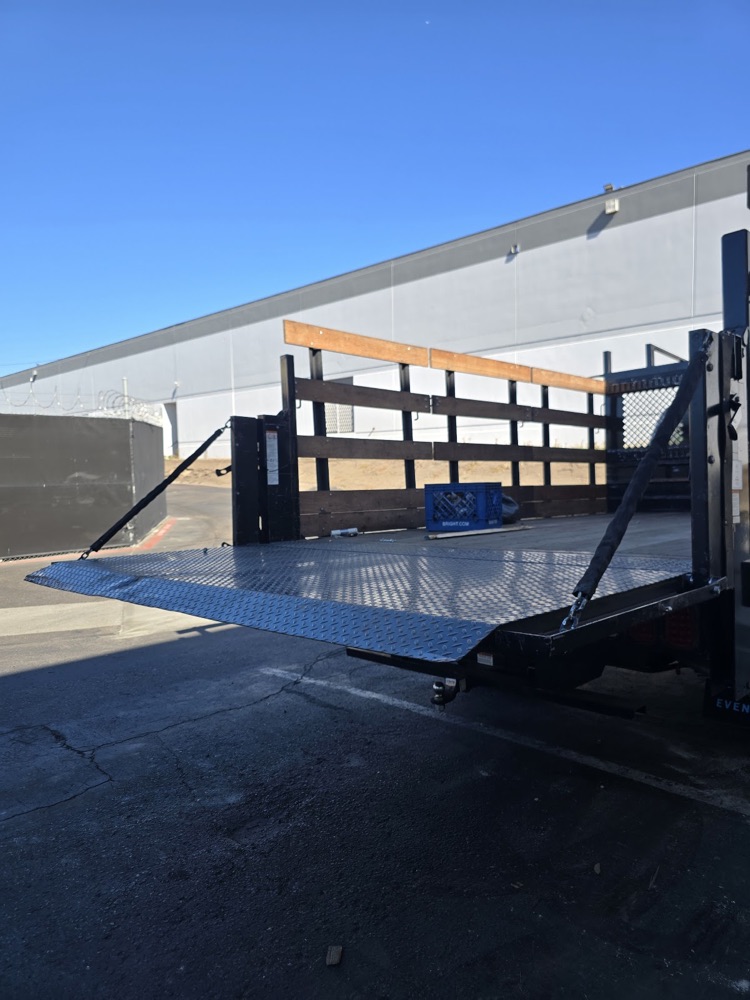 Repaired diamond plate liftgate platform after